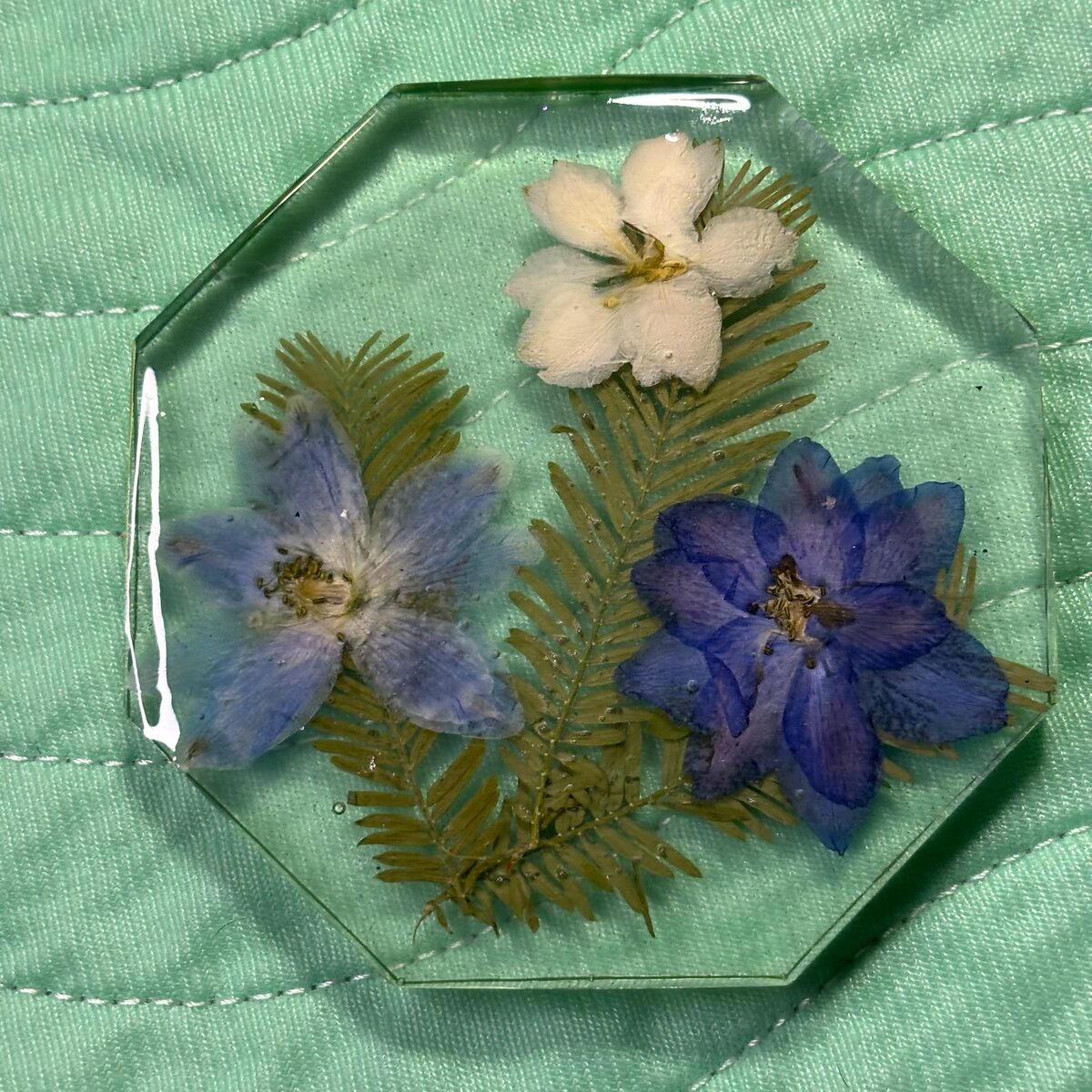 Clear octagon resin tray with blue and white pressed flowers