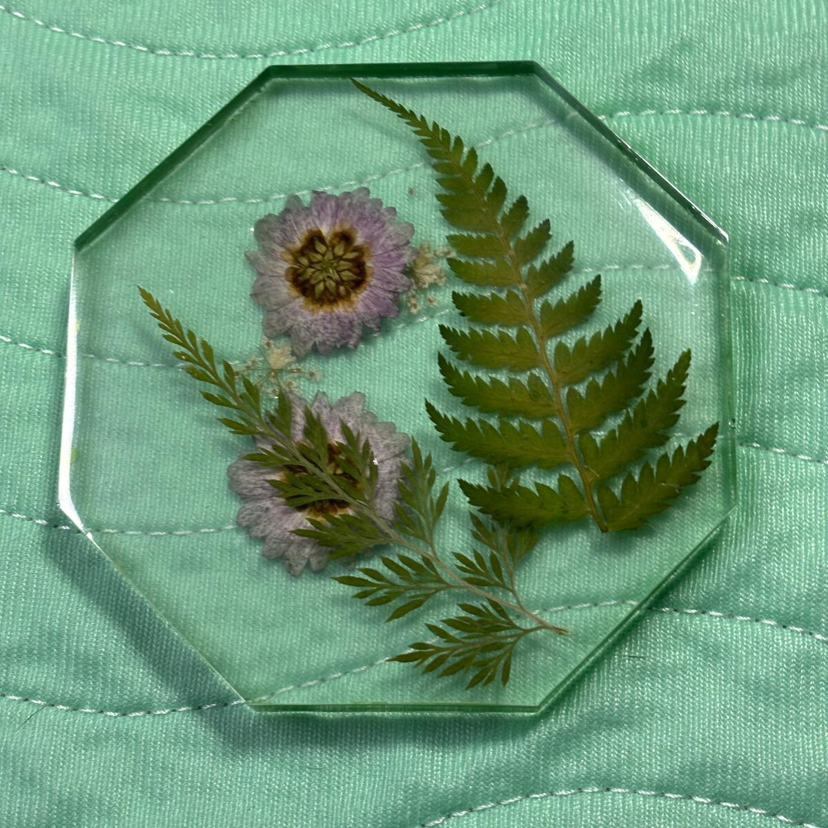 Clear octagon resin tray with fern leaves and pale flowers