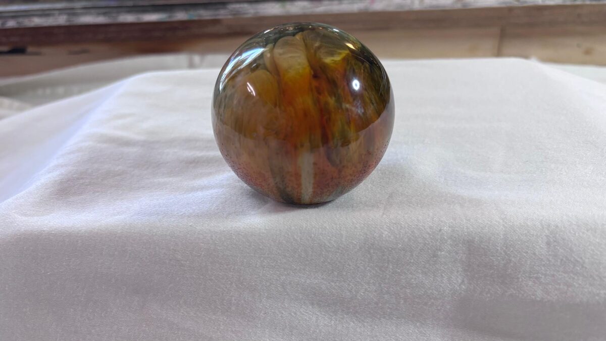 Handmade amber-toned resin sphere