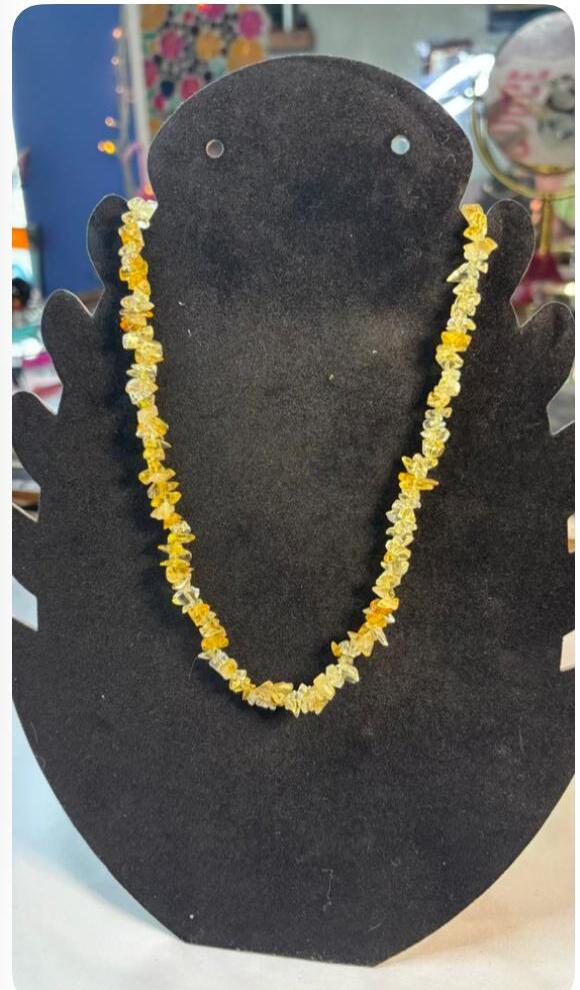 Yellow chip 18 inch necklace on a black display bust